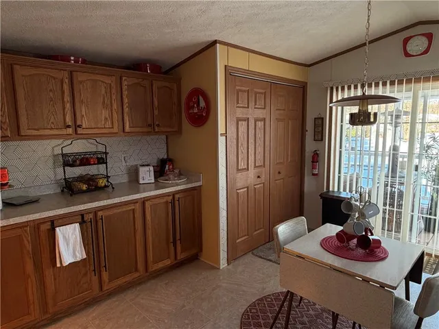 a kitchen with stainless steel appliances granite countertop a sink and cabinets
