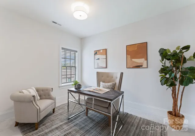 a view of a hallway with seating area