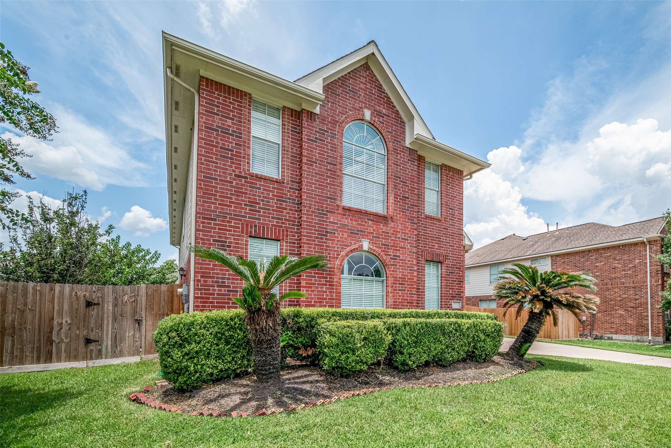 9218 Memorial Pines Way Spring, TX 77379 - Photo 5 of 39 This side of the house features windows overlooking the garage, which includes a convenient door to the side yard. Upstairs, enjoy a spacious game room.