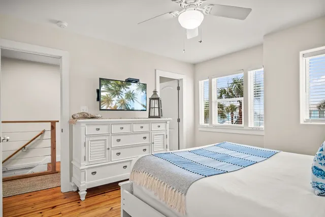 a bathroom with a granite countertop sink a mirror shower and bathtub