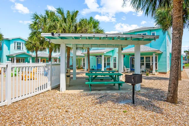 a view of an chairs and tables in the patio