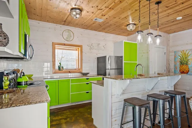 a kitchen with a table and chairs