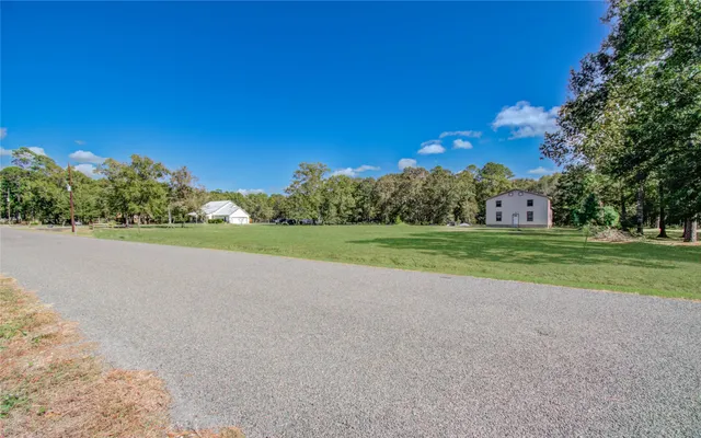 a view of a house with a big yard