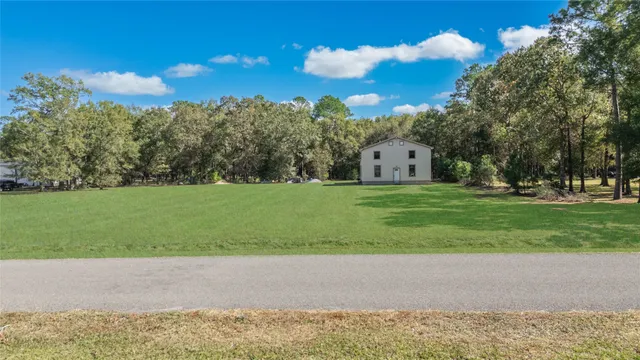 a view of a playground with green space