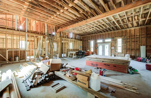 a view of a chairs and table in a patio