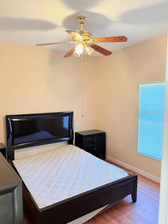 a room with a bed and a chandelier