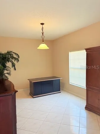 a room with a table and a fireplace