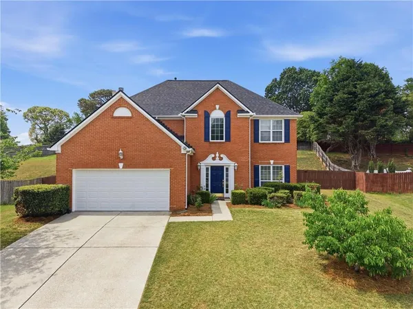 front view of a house with a yard