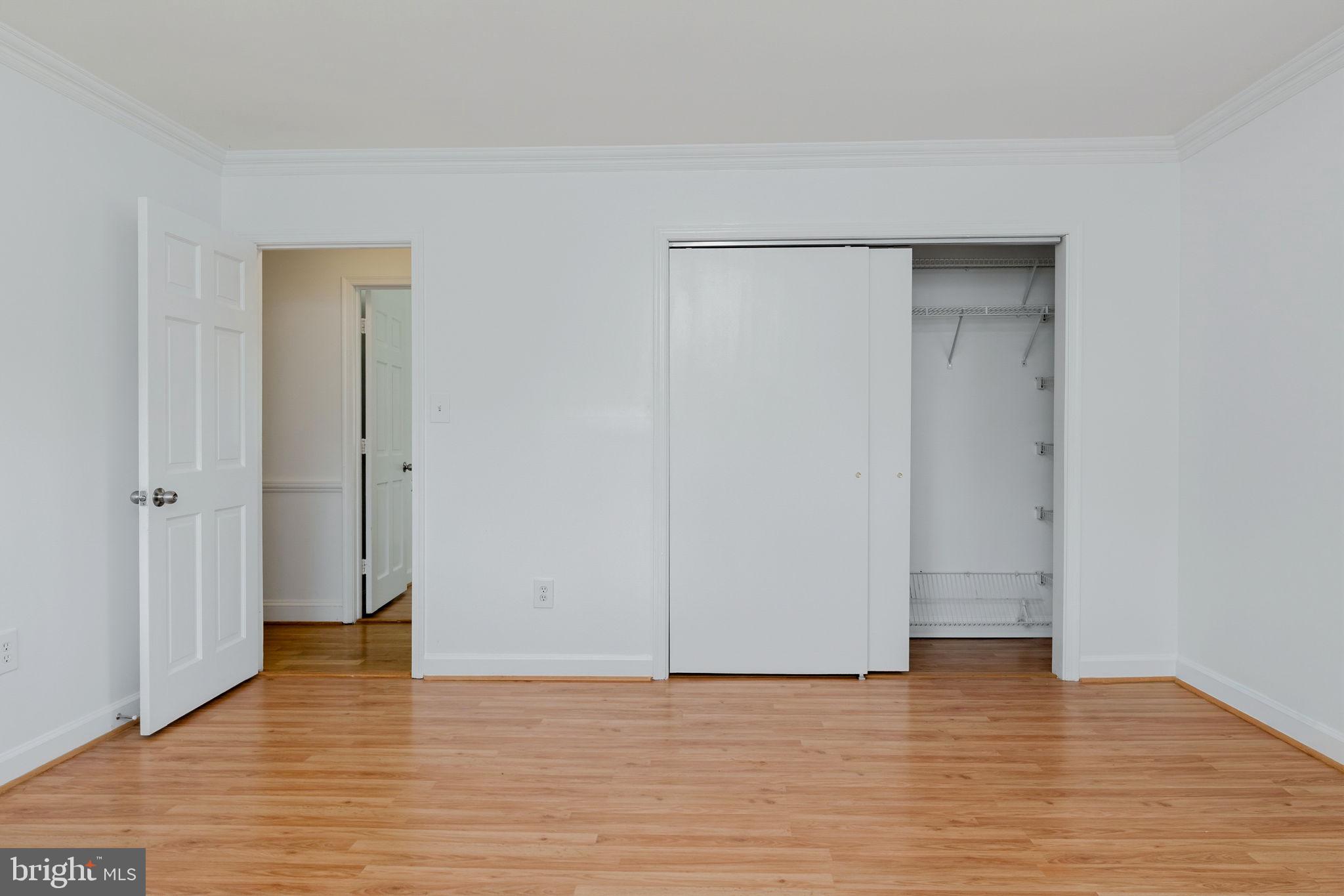11325 Bacon Race Road Woodbridge, VA 22192 - Photo 28 of 54 a view of an empty room with wooden floor and closet