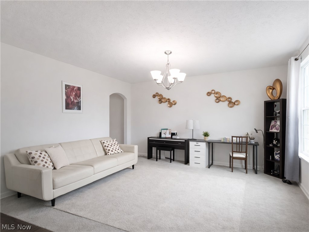 4509 Millbrook Way Akron, OH 44321 - Photo 12 of 27 Spacious interior featuring light neutral walls and light gray carpeting