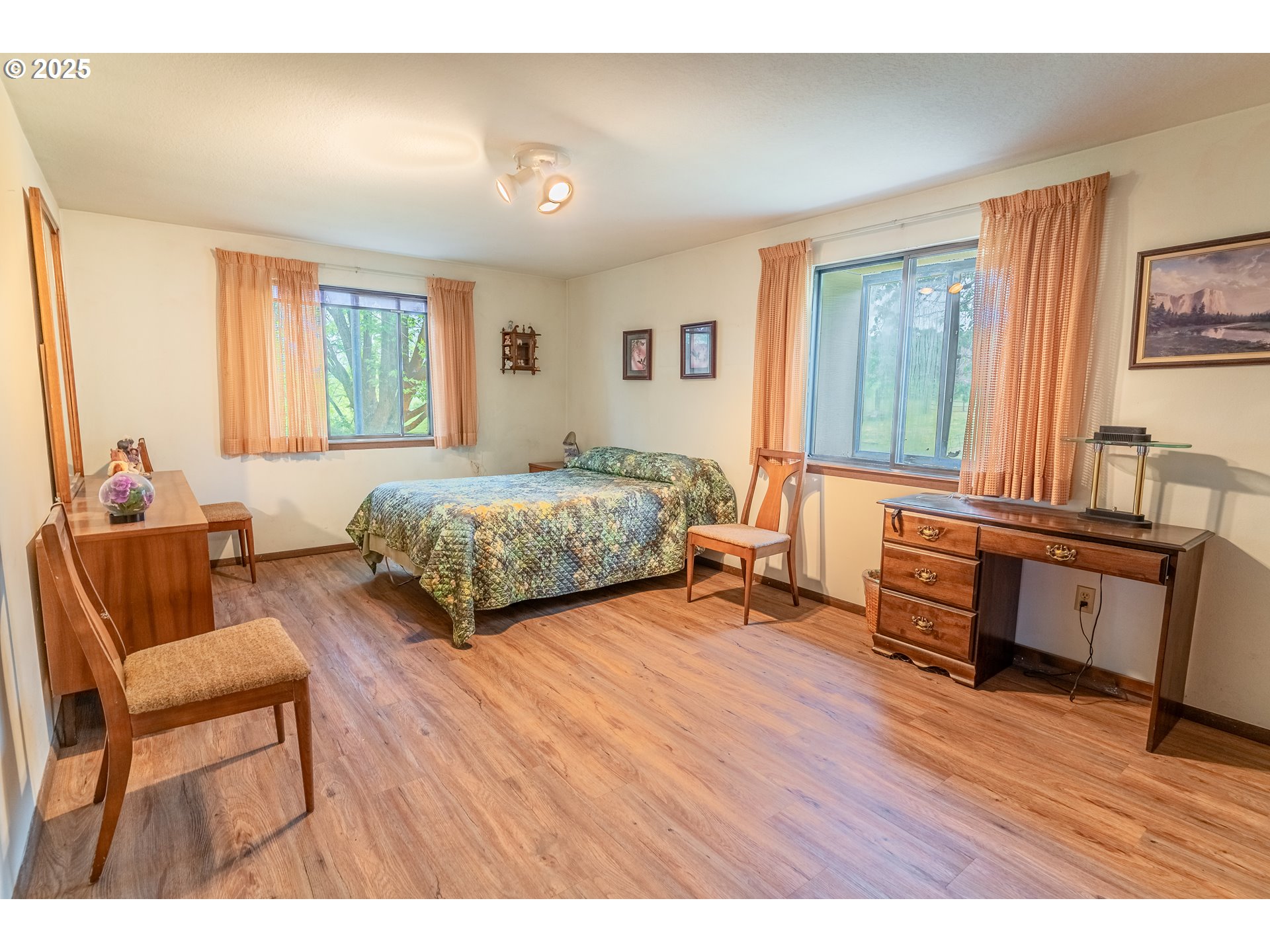 47433 Slaughterhouse Road Halfway, OR 97834 - Photo 12 of 16 a bedroom with furniture and a wooden floor