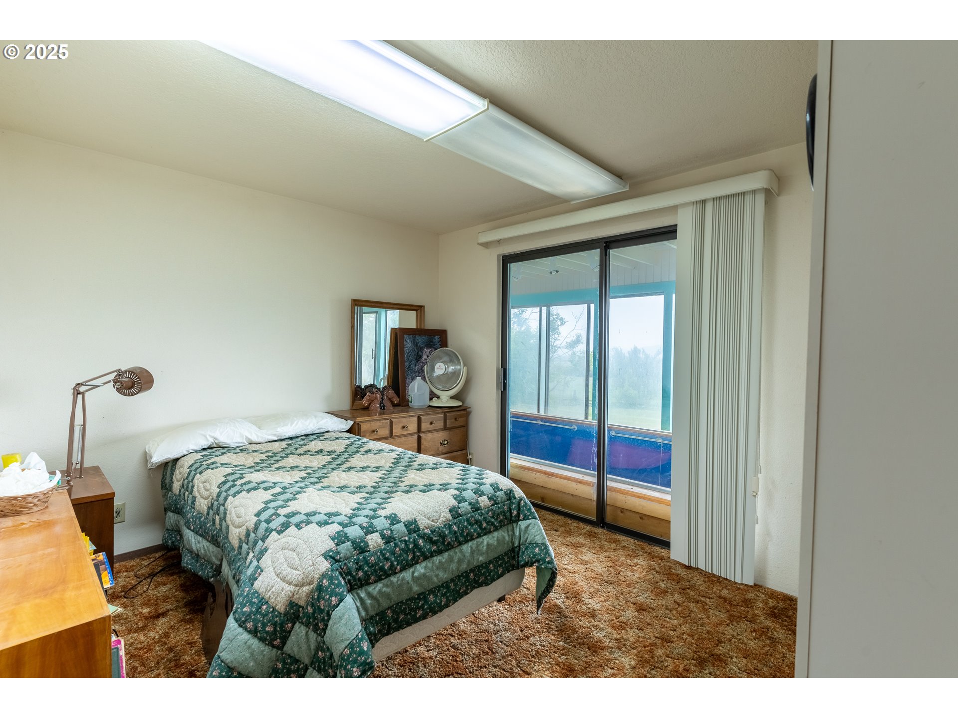 47433 Slaughterhouse Road Halfway, OR 97834 - Photo 15 of 16 a bedroom with a bed and a window