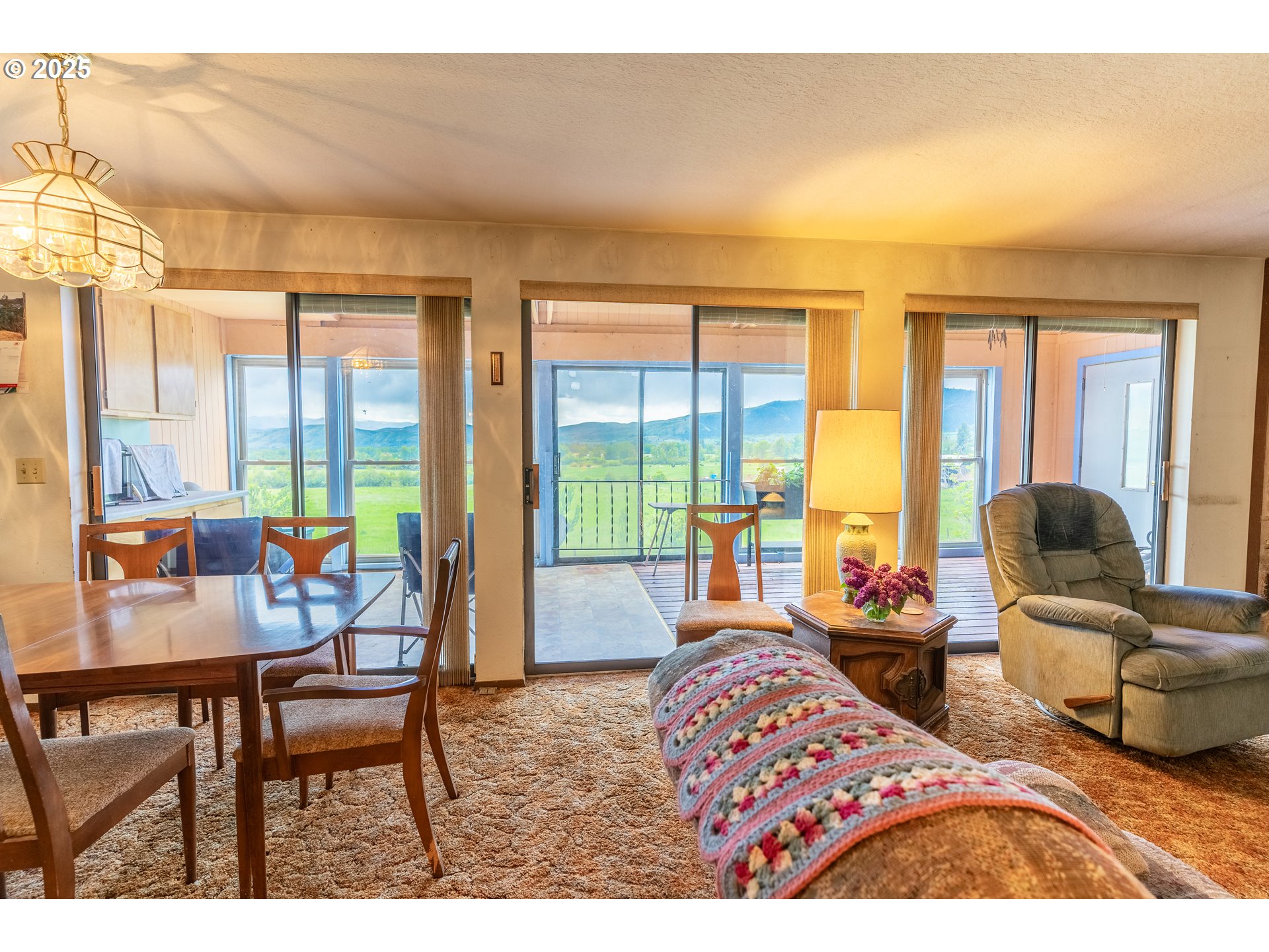 47433 Slaughterhouse Road Halfway, OR 97834 - Photo 2 of 16 a bedroom with furniture and large windows