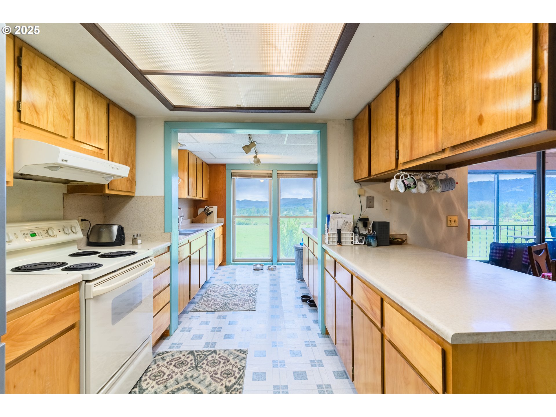47433 Slaughterhouse Road Halfway, OR 97834 - Photo 6 of 16 a kitchen with stainless steel appliances granite countertop a sink and cabinets