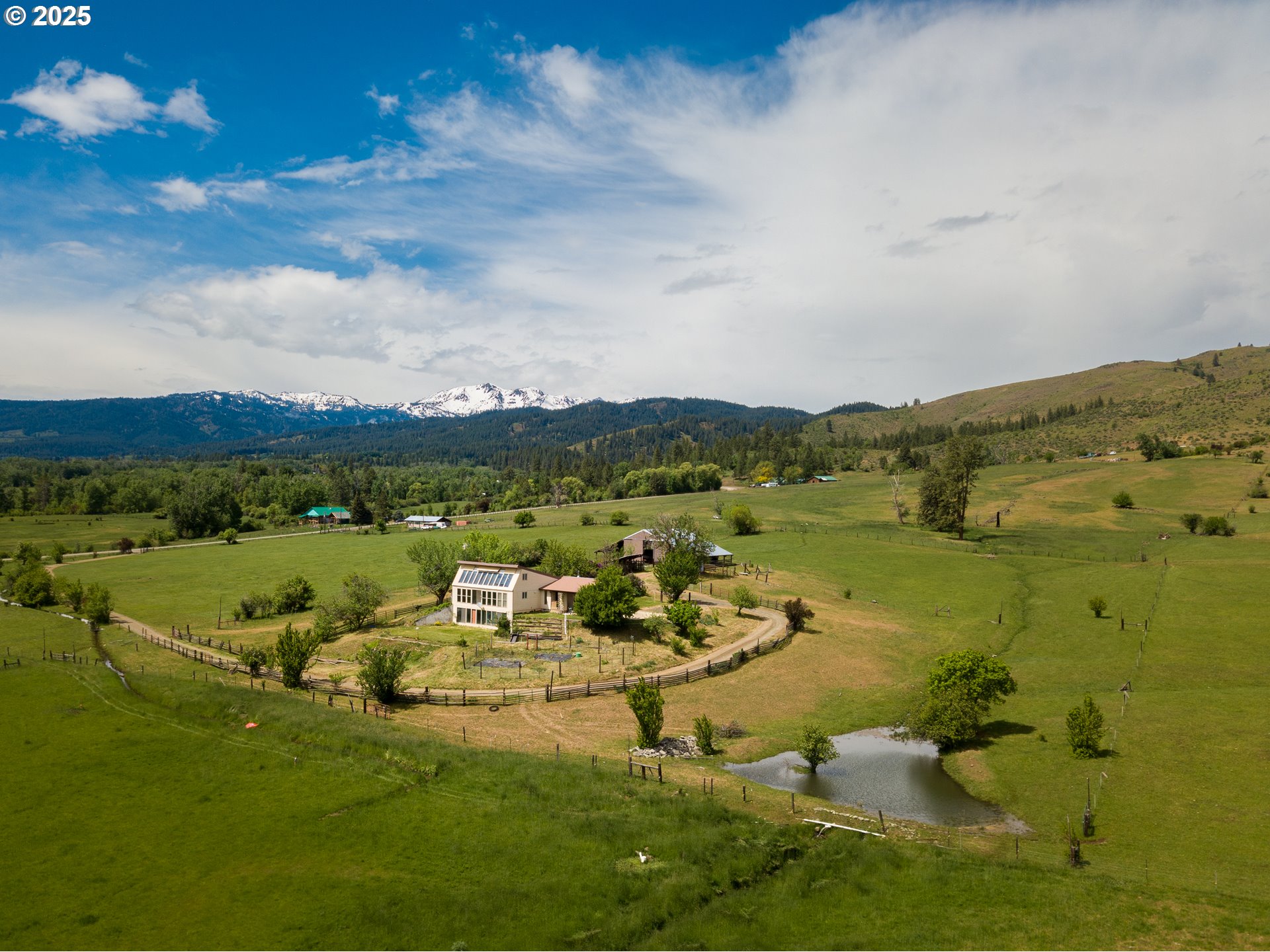 47433 Slaughterhouse Road Halfway, OR 97834 - Photo 8 of 16 a view of a lake with houses in the background