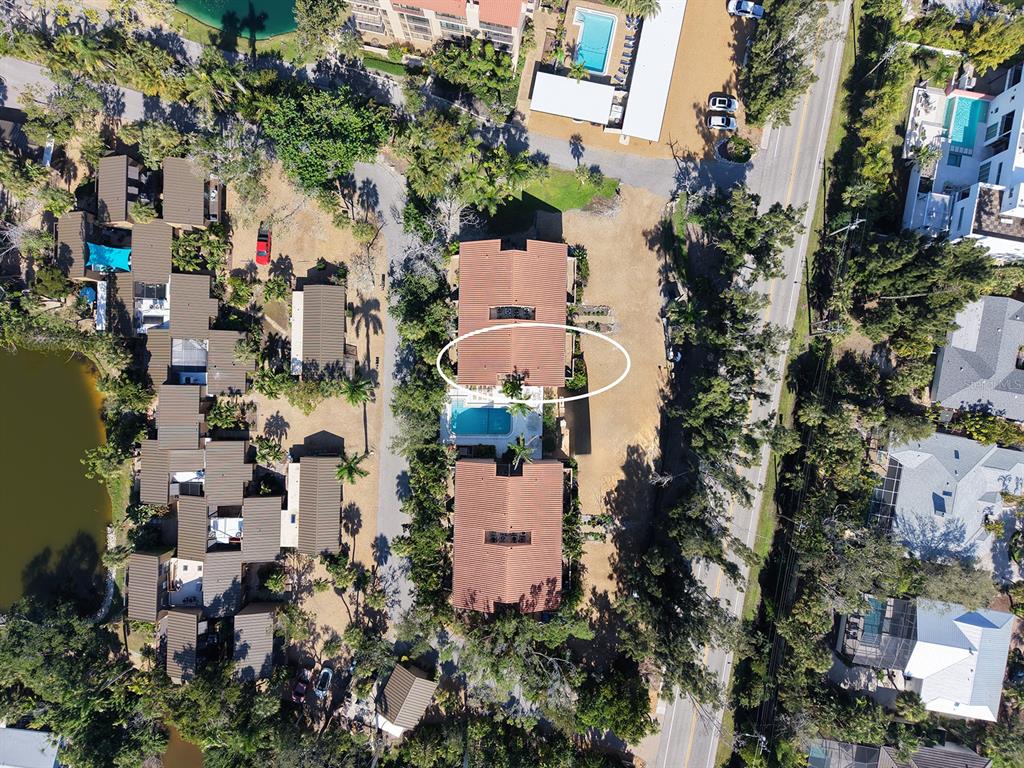 117 Pass Key Road, Unit 117 Sarasota, FL 34242 - Photo 5 of 59 an aerial view of multiple houses with yard