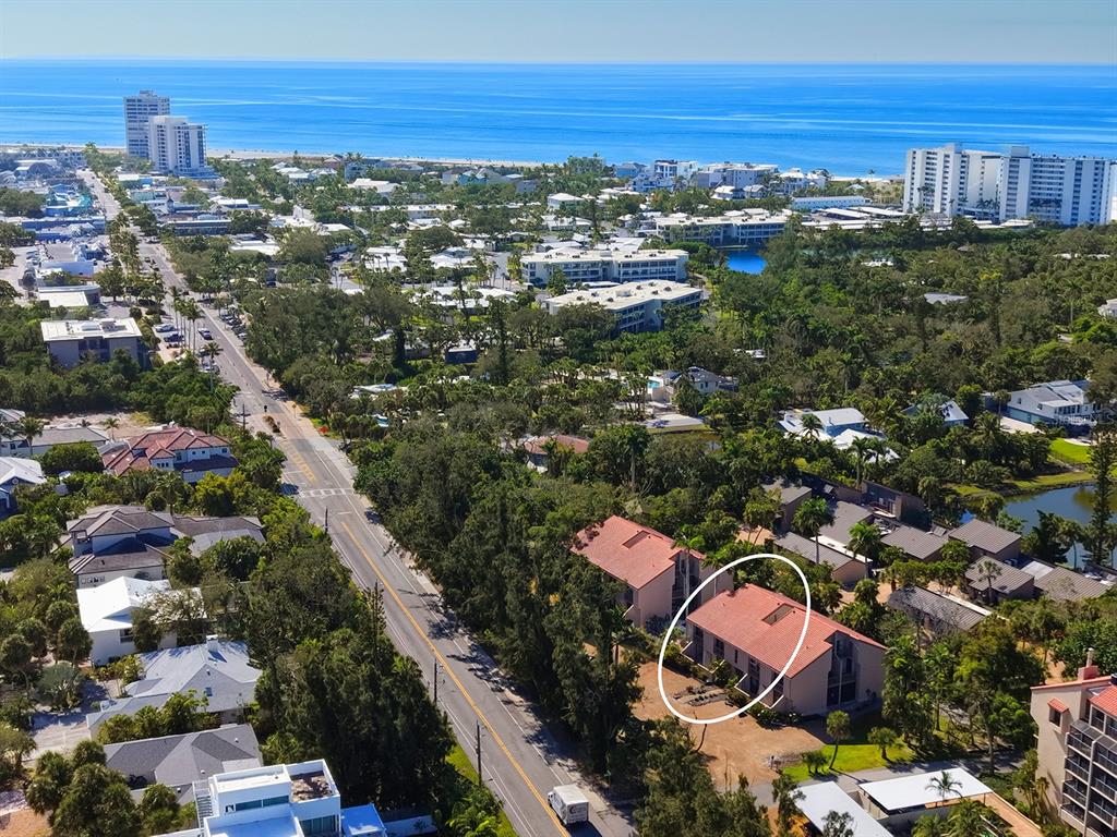 117 Pass Key Road, Unit 117 Sarasota, FL 34242 - Photo 6 of 59 an aerial view of residential houses with outdoor space