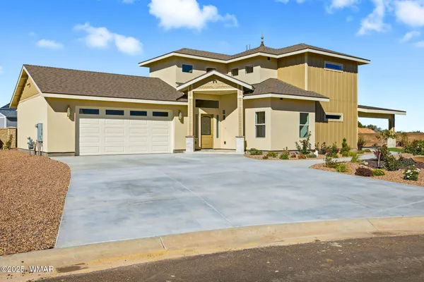 a front view of a house with a outdoor space