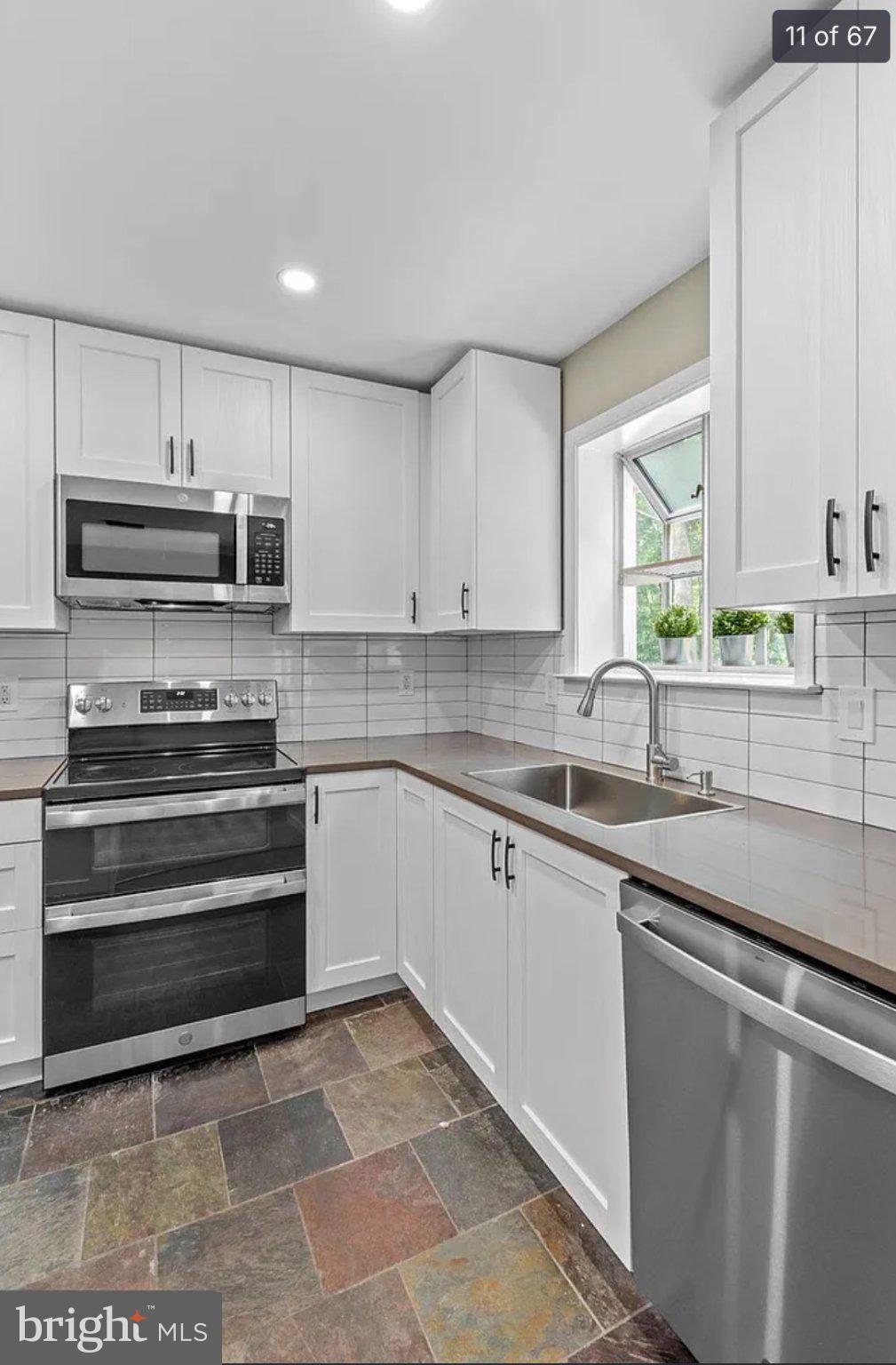 3906 Valley Ridge Drive Fairfax, VA 22033 - Photo 11 of 58 Modern kitchen with sleek finishes.
