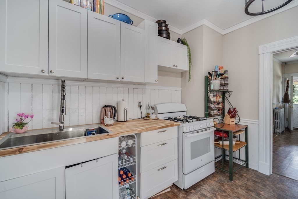 37 Phoenix Street Springfield, MA 01104 - Photo 12 of 27 a kitchen with cabinets appliances a sink and a counter top