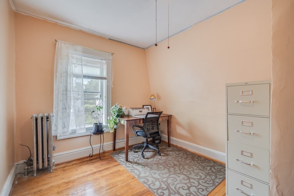 37 Phoenix Street Springfield, MA 01104 - Photo 20 of 27 a view of a workspace with furniture and a window