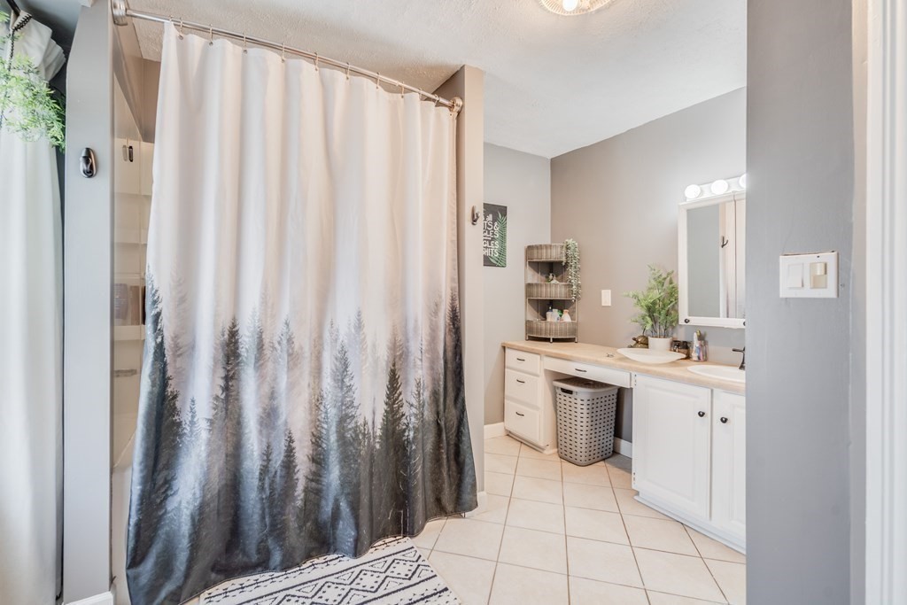 37 Phoenix Street Springfield, MA 01104 - Photo 22 of 27 a kitchen with white cabinets and sink