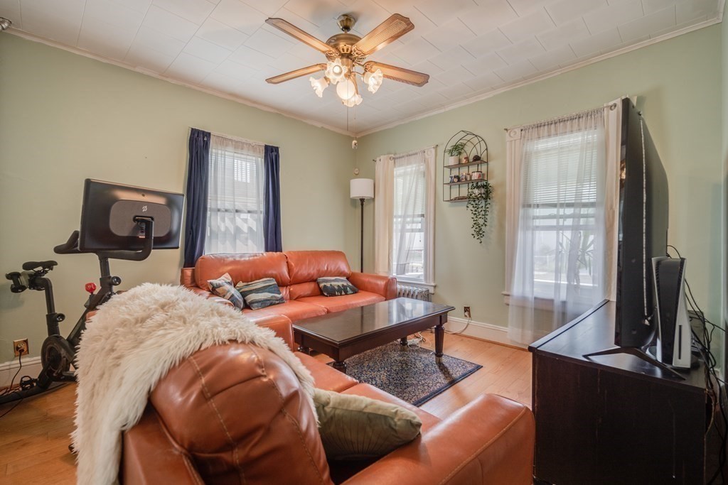 37 Phoenix Street Springfield, MA 01104 - Photo 4 of 27 a living room with furniture a chandelier and a window