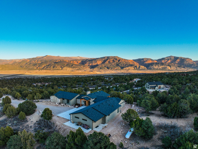 6688 Bareback Road Cedar City, UT 84720 - Photo 2 of 58 Aerial view of property and surrounding area with a mountain backdrop