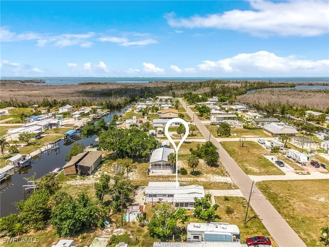 an aerial view of residential building with ocean view