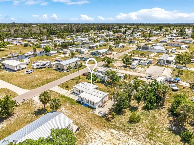 an aerial view of residential building with parking space