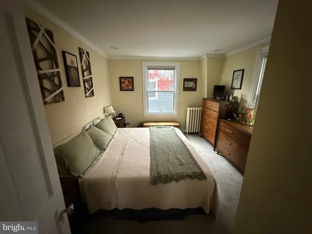 a bedroom with a bed and furniture