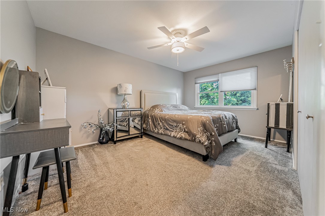 595 Moorfield Road Fairlawn, OH 44313 - Photo 21 of 50 Carpeted bedroom featuring ceiling fan and baseboards