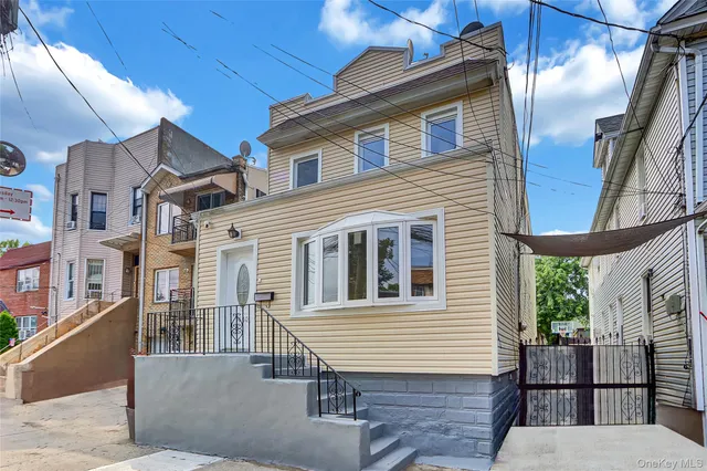 a front view of a house with many windows