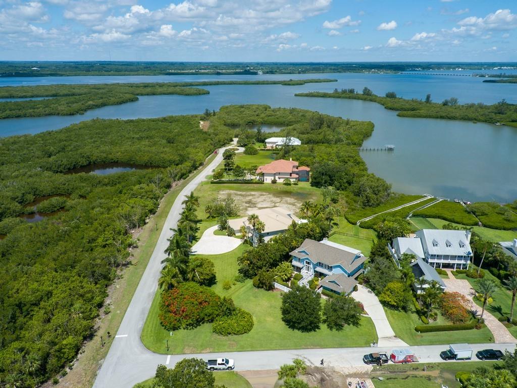 1850 Bayview Court Vero Beach, FL 32963 - Photo 12 of 23 an aerial view of a house with a yard and lake view