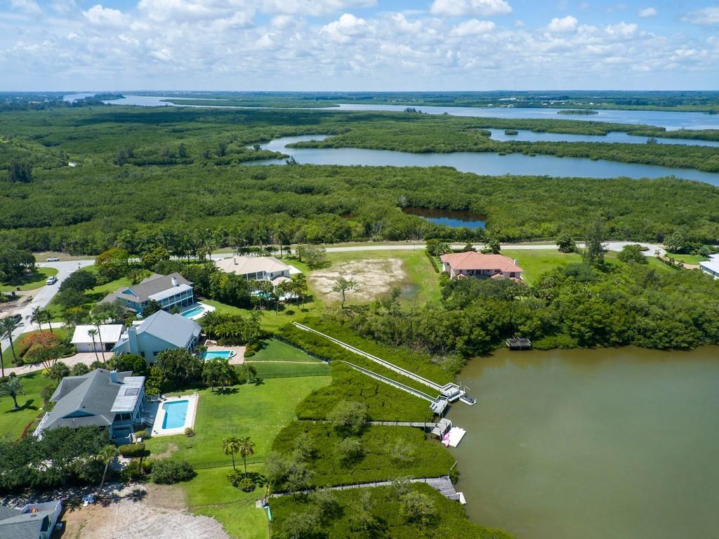 1850 Bayview Court Vero Beach, FL 32963 - Photo 14 of 23 a view of a lake with a building in the background