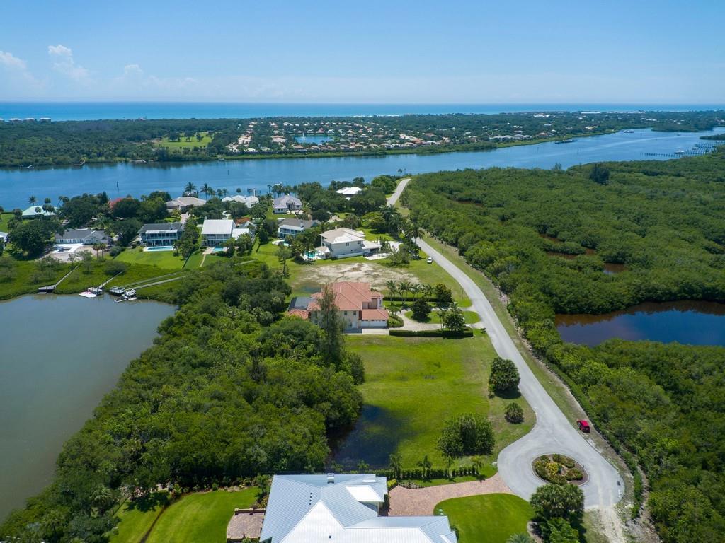 1850 Bayview Court Vero Beach, FL 32963 - Photo 16 of 23 an aerial view of a house with a garden and lake view
