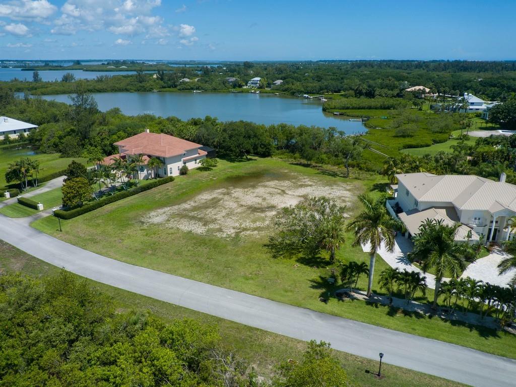 1850 Bayview Court Vero Beach, FL 32963 - Photo 4 of 23 an aerial view of a residential houses with outdoor space and lake view