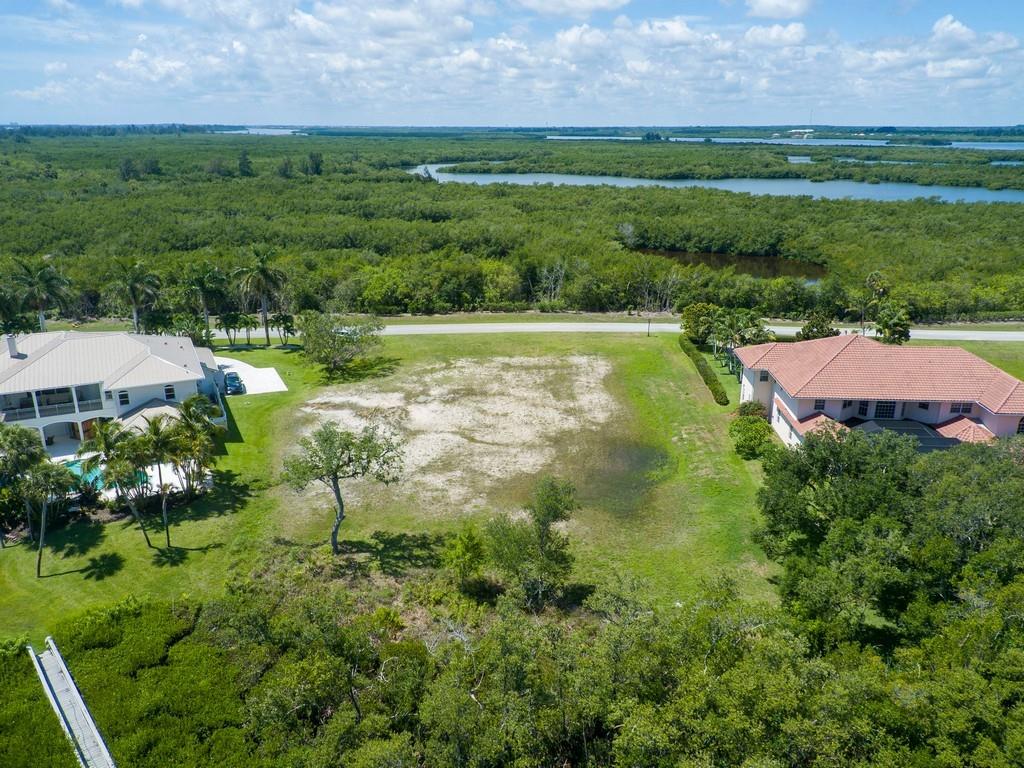 1850 Bayview Court Vero Beach, FL 32963 - Photo 6 of 23 a view of a garden with a building in the background