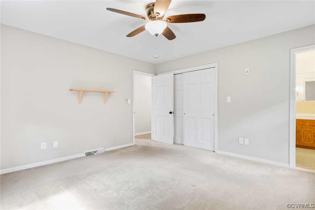 7000 Venable Road Kents Store, VA 23084 - Photo 15 of 45 an empty room with chandelier fan