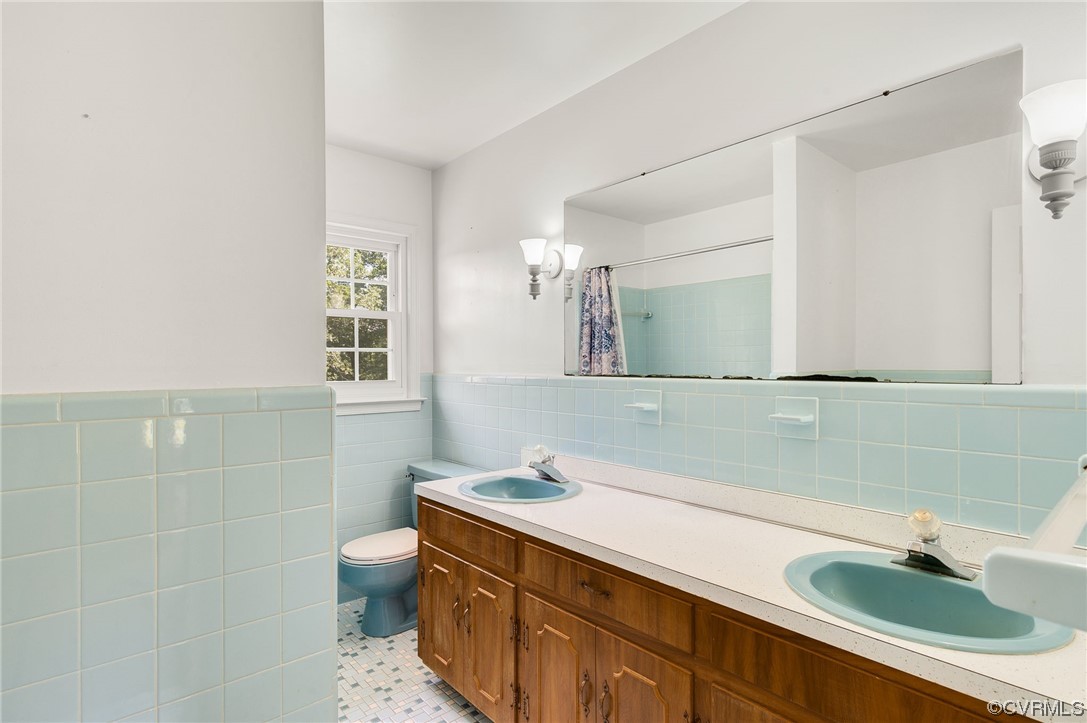 7000 Venable Road Kents Store, VA 23084 - Photo 21 of 45 a bathroom with a sink and a mirror