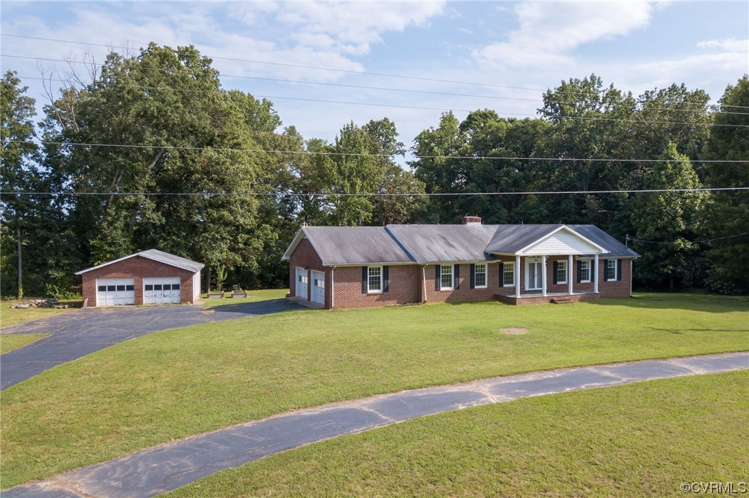7000 Venable Road Kents Store, VA 23084 - Photo 29 of 45 a white house with a big yard and large trees