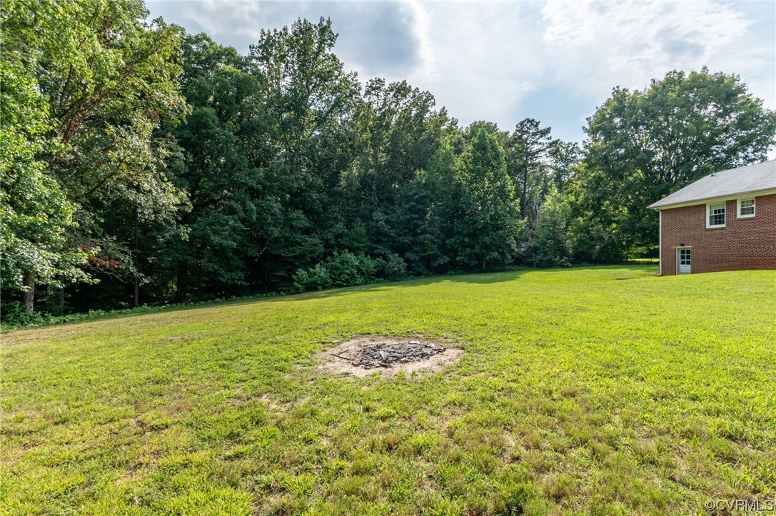 7000 Venable Road Kents Store, VA 23084 - Photo 45 of 45 a view of a swimming pool and trees in the background