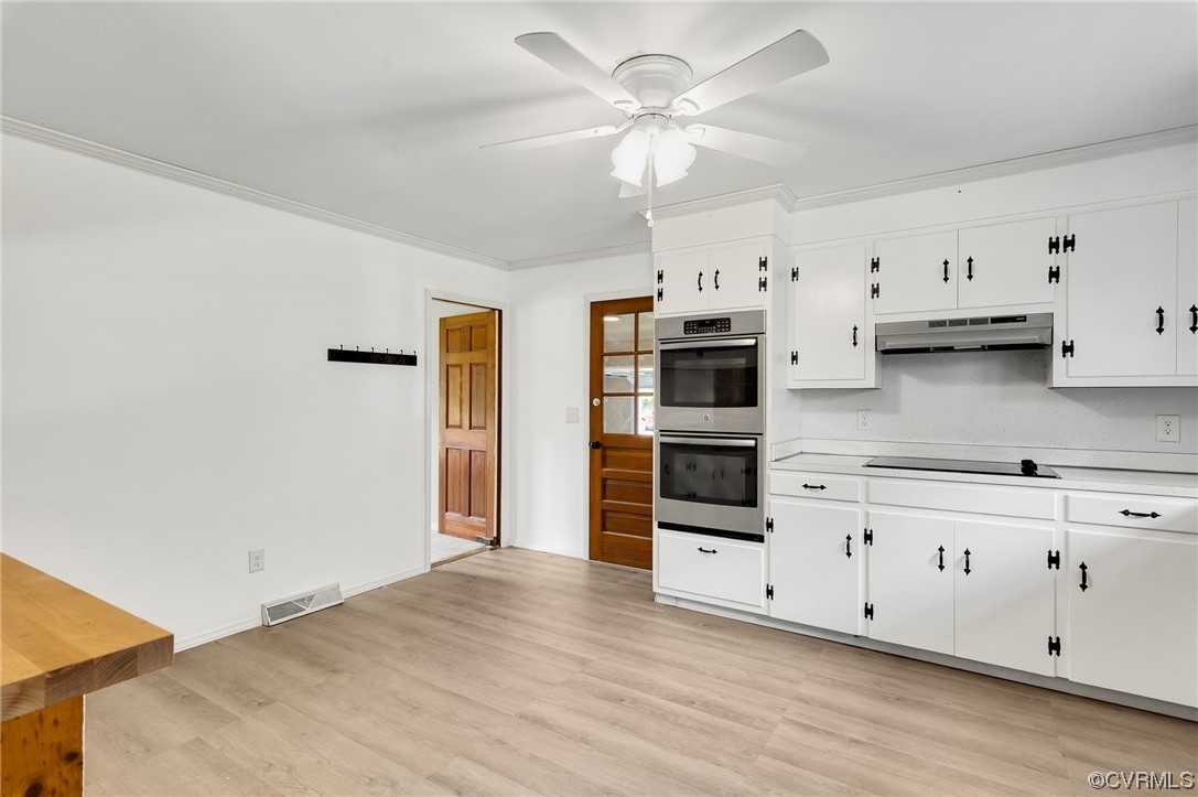 7000 Venable Road Kents Store, VA 23084 - Photo 9 of 45 a view of a kitchen with stainless steel appliances cabinets and wooden floor