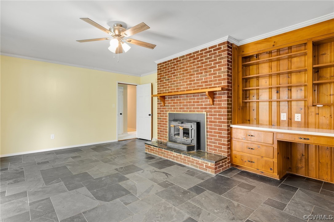 7000 Venable Road Kents Store, VA 23084 - Photo 10 of 45 a view of an empty room with a fireplace and a ceiling fan