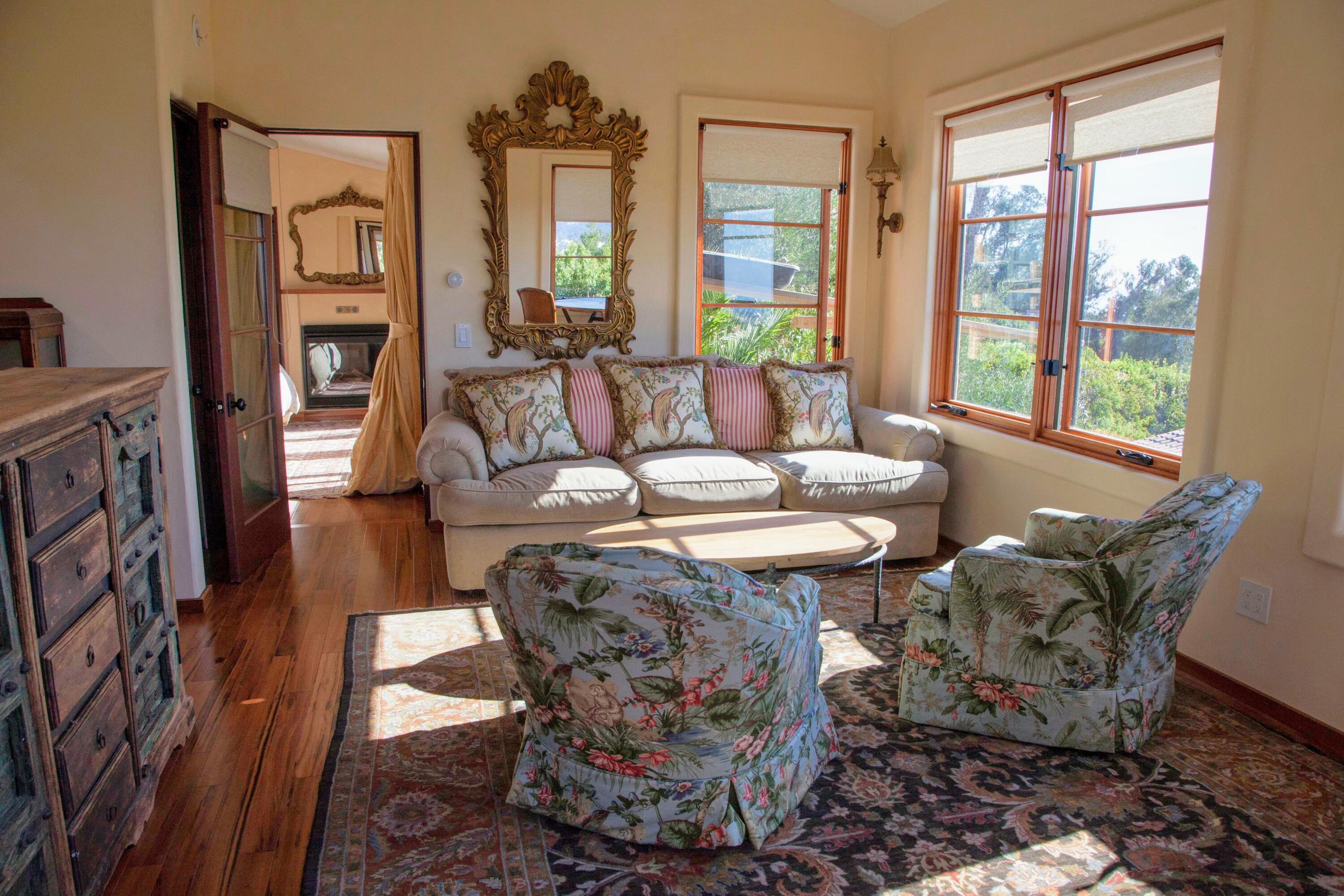 1933 Eucalyptus Hill Road Santa Barbara, CA 93108 - Photo 2 of 11 a living room with furniture and a large window