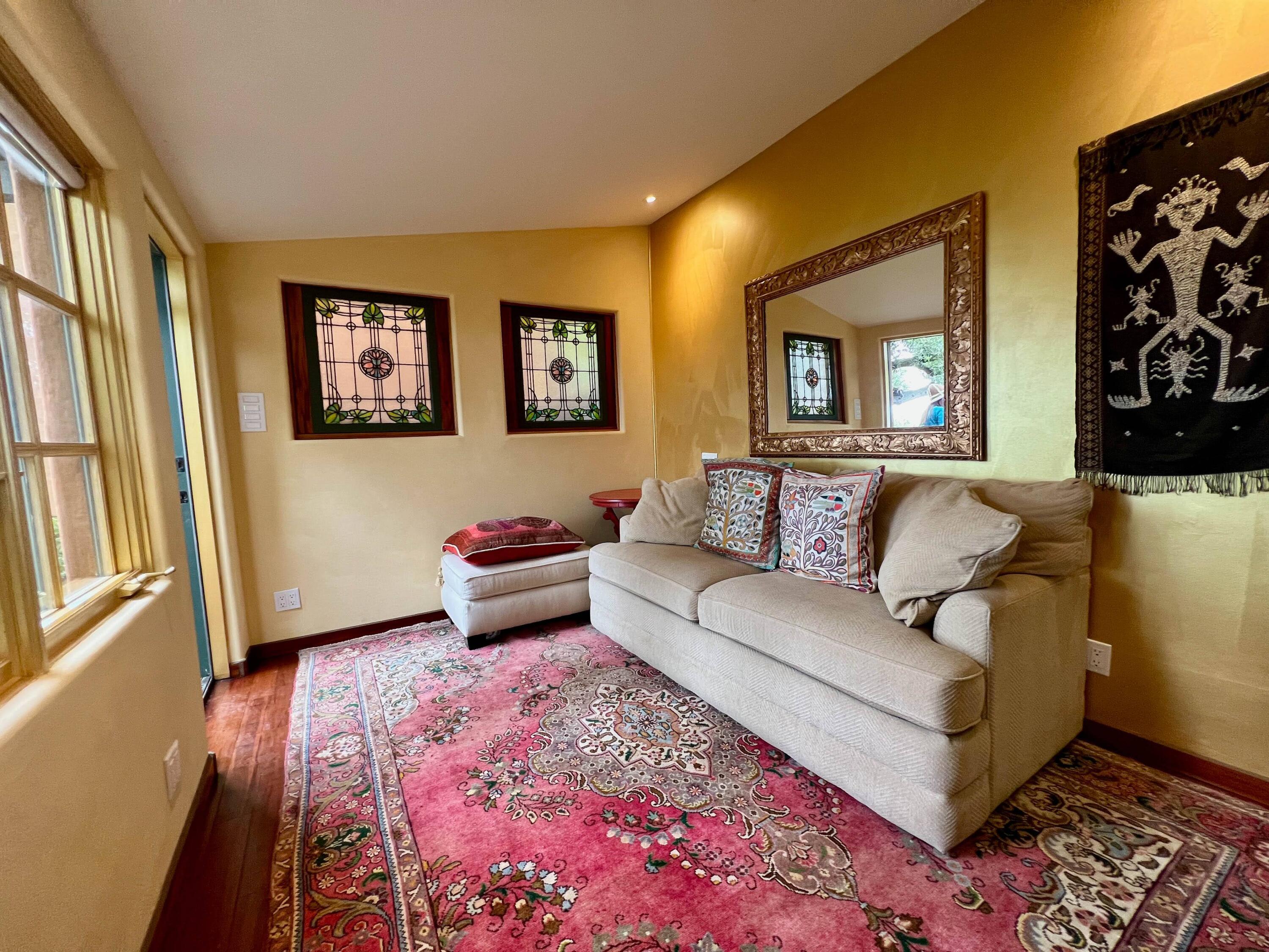 1933 Eucalyptus Hill Road Santa Barbara, CA 93108 - Photo 8 of 11 a living room with furniture and a rug
