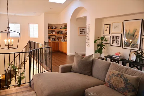 a living room with furniture with wooden floor