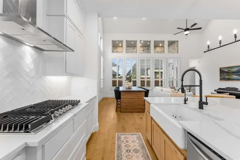 a kitchen with a stove and a sink