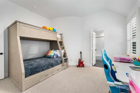 a bed room with a bed and gym equipment