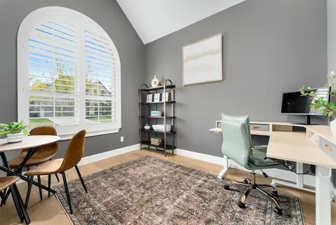 a workspace with furniture and a window